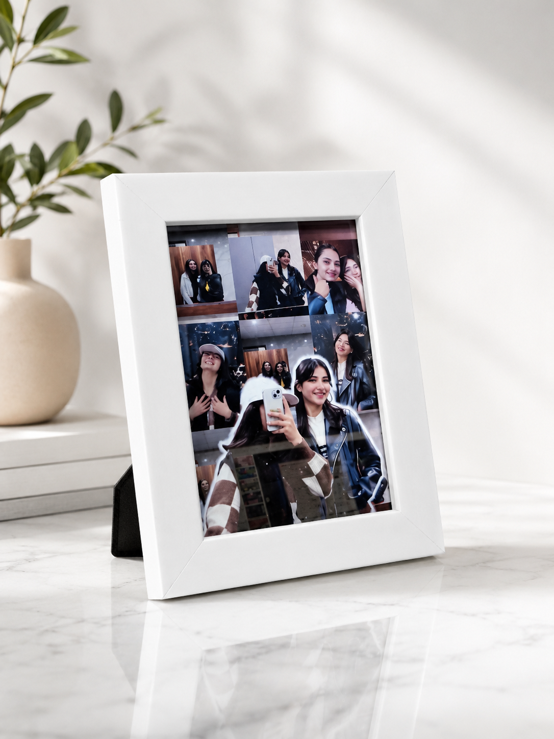 Digital photo frame displaying a collage of images on a white surface.