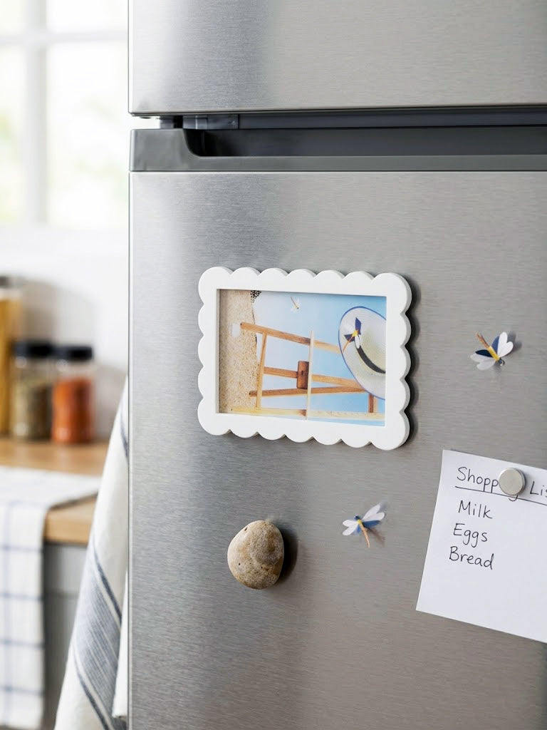 Decorative Photo Frame Fridge magnets on a Stainless steel refrigerator ,made by Kustomade, India.