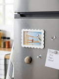 Decorative Photo Frame Fridge magnets on a Stainless steel refrigerator ,made by Kustomade, India.
