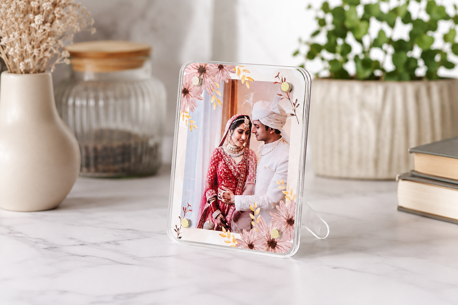 Acrylic Photo Frame Fridge Magnet displaying a couple in traditional attire on a marble surface with decorative items.